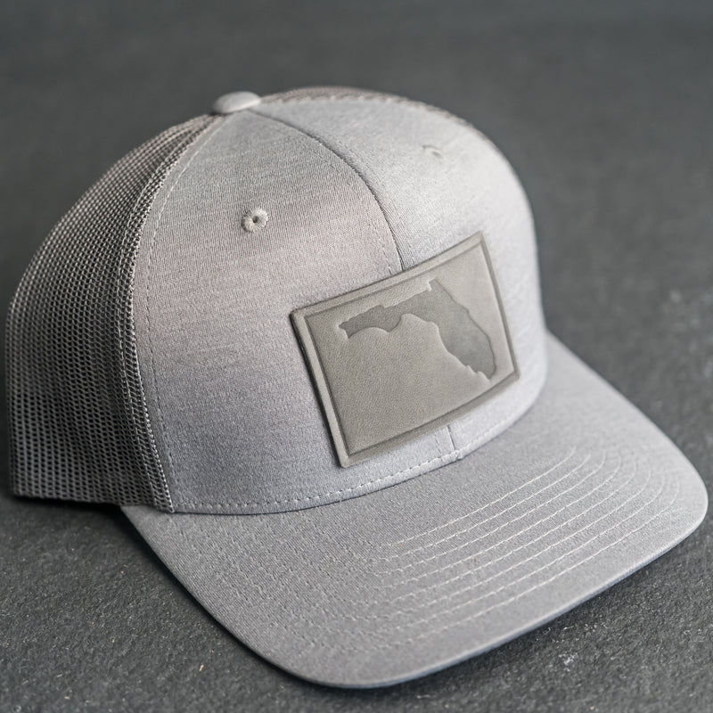 Leather Patch Performance Style Trucker Hat - Florida Stamp