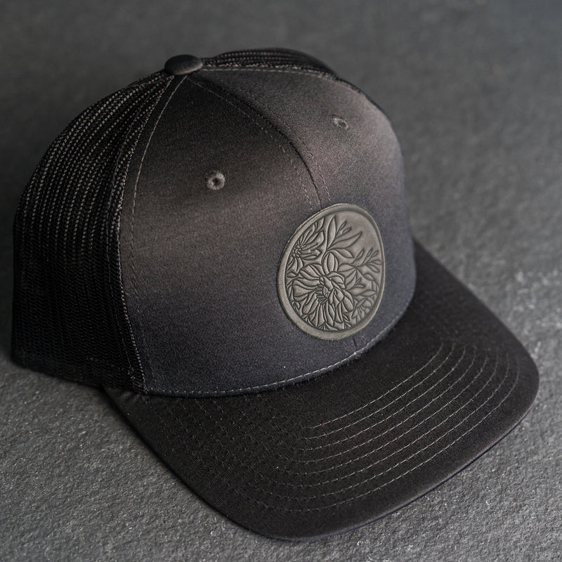 Leather Patch Performance Style Trucker Hat - Circle Patch - Floral Stamp