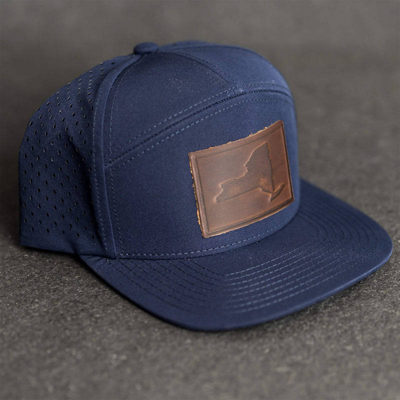 Leather Patch Flat Bill 7 Panel Perforated Performance Hat - New York Stamp