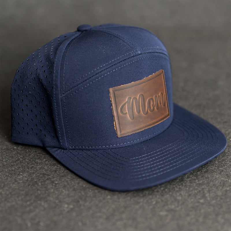 Leather Patch Flat Bill 7 Panel Perforated Performance Hat - Mom Cursive Stamp