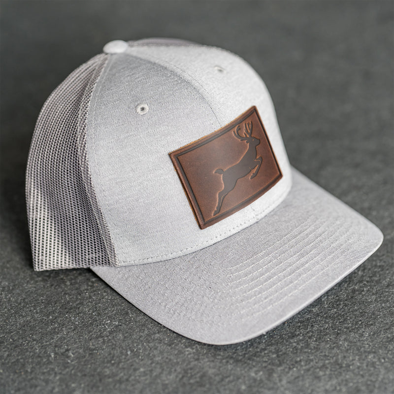 Leather Patch Performance Style Trucker Hat - Deer Stamp