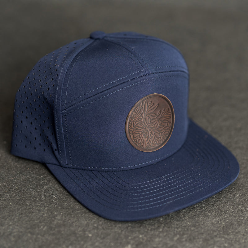 Leather Patch Flat Bill 7 Panel Perforated Performance Hat - Circle Patch - Floral Stamp