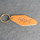 Leather Motel Key Shape Keychain with a Blessed Stamp Design