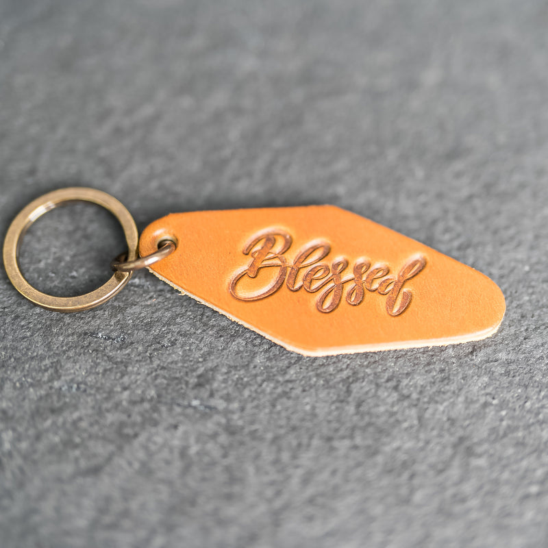 Leather Motel Key Shape Keychain with a Blessed Stamp Design