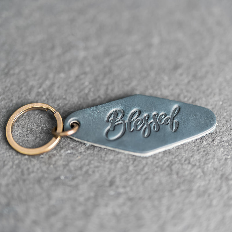 Leather Motel Key Shape Keychain with a Blessed Stamp Design