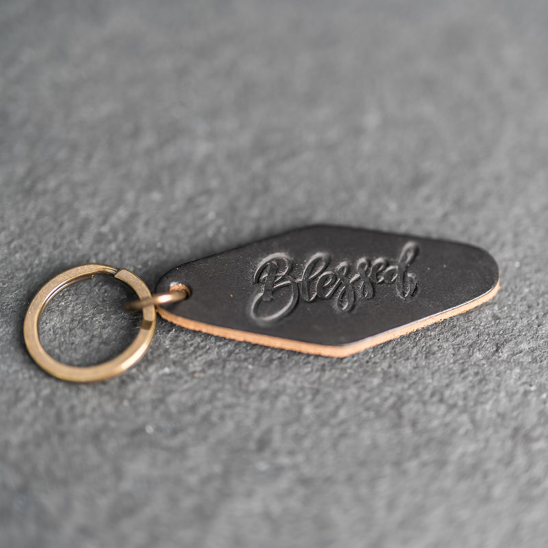 Leather Motel Key Shape Keychain with a Blessed Stamp Design