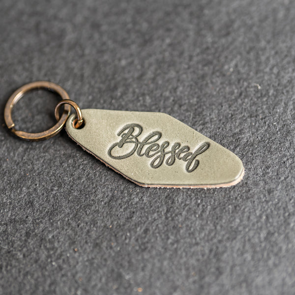 Leather Motel Key Shape Keychain with a Blessed Stamp Design