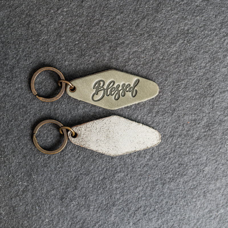 Leather Motel Key Shape Keychain with a Blessed Stamp Design