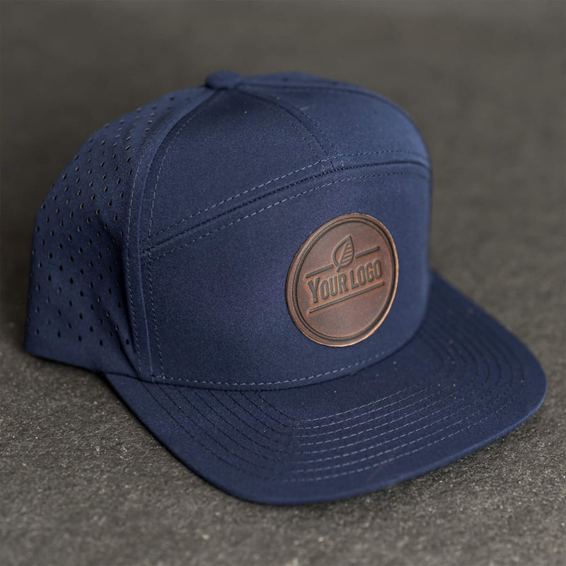Your Logo on a Leather Patch Flat Bill 7 Panel Perforated Performance Hat - Circle Patch