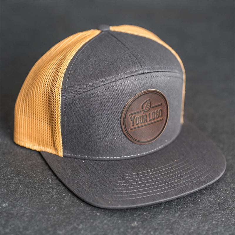 Your Logo on a Leather Patch Flat Bill 7 Panel Trucker Hat - Circle Patch
