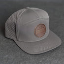 Your Logo on a Leather Patch Flat Bill 7 Panel Perforated Performance Hat - Circle Patch