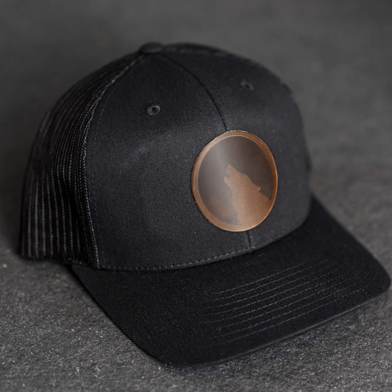 Leather Patch Trucker Style Hat - Wolf Stamp