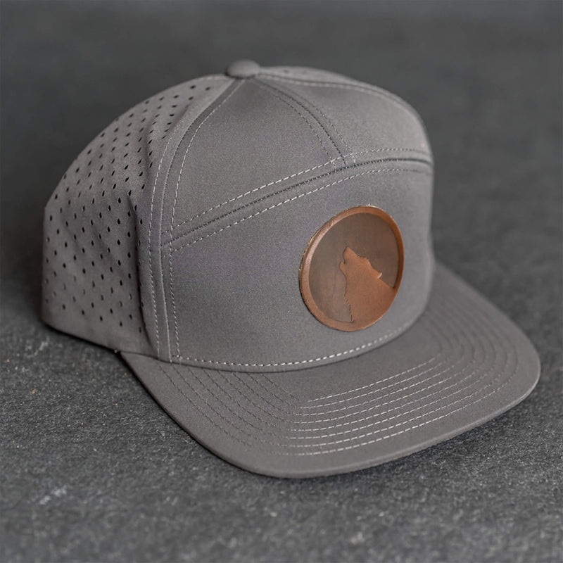 Leather Patch Flat Bill 7 Panel Perforated Performance Hat - Wolf Stamp