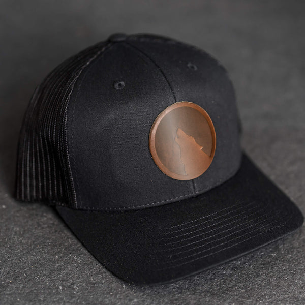 Leather Patch Trucker Style Hat - Wolf Stamp