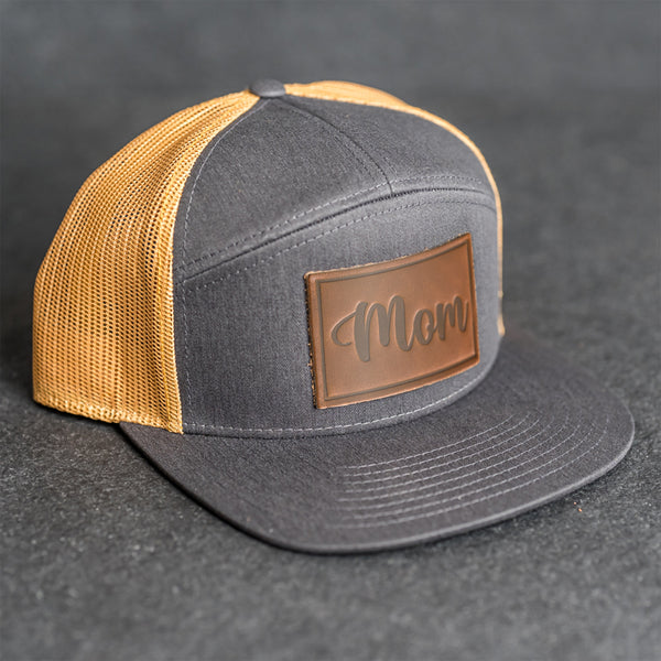 Leather Patch Flat Bill 7 Panel Trucker Hat - Mom Cursive Stamp