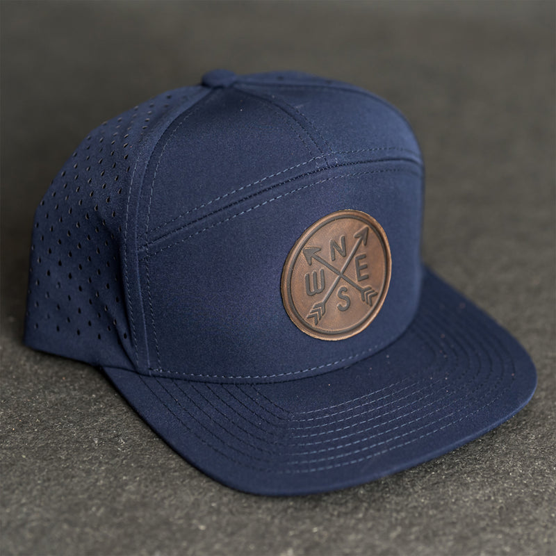 Leather Patch Flat Bill 7 Panel Perforated Performance Hat - Compass Rose Stamp