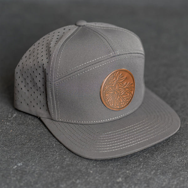 Leather Patch Flat Bill 7 Panel Perforated Performance Hat - Circle Patch - Floral Stamp