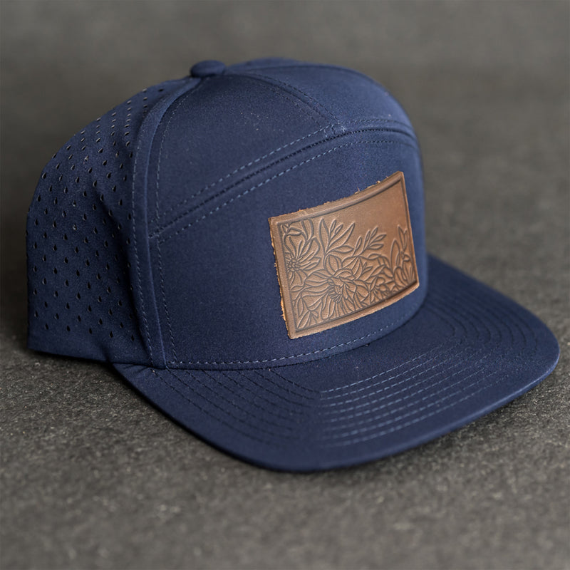Leather Patch Flat Bill 7 Panel Perforated Performance Hat - Floral Stamp