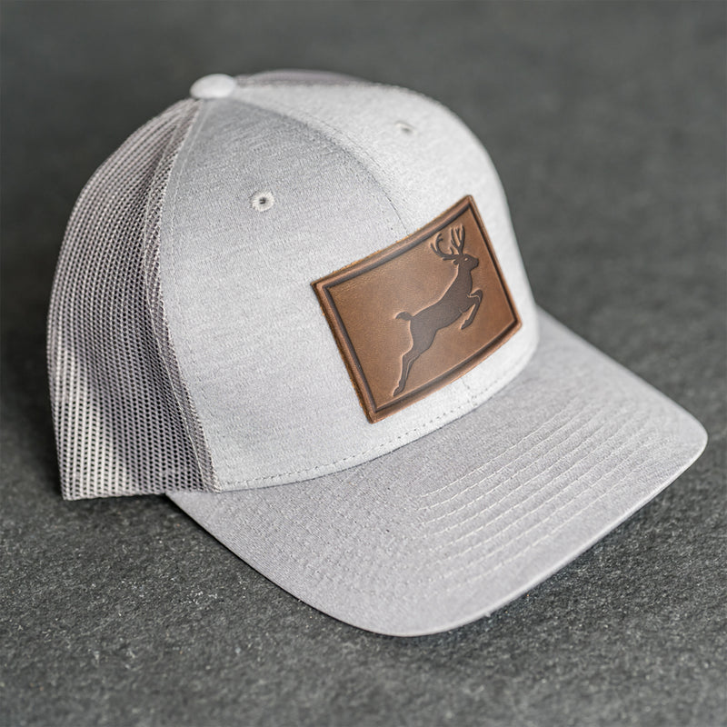 Leather Patch Performance Style Trucker Hat - Deer Stamp