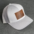 Leather Patch Performance Style Trucker Hat - Pine Tree Ridgeline Stamp