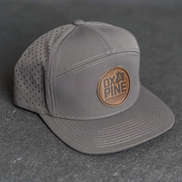 Leather Patch Flat Bill 7 Panel Perforated Performance Hat - Ox & Pine Logo Stamp - Circle