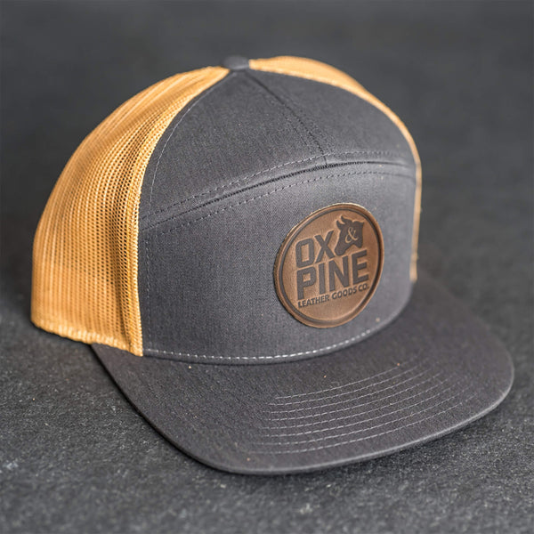 Leather Patch Flat Bill 7 Panel Trucker Hat - Ox & Pine Logo Stamp - Circle