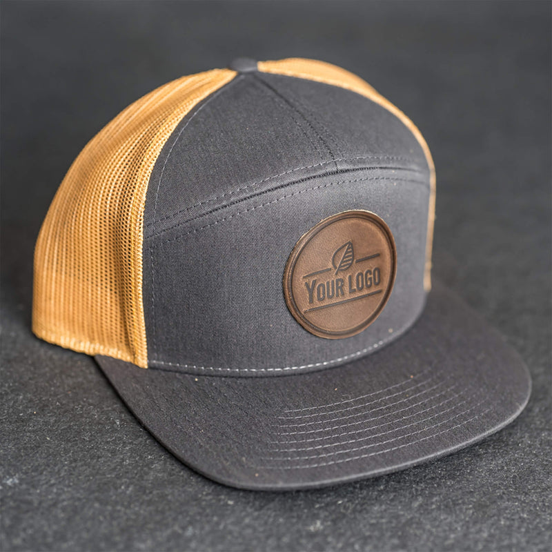 Your Logo on a Leather Patch Flat Bill 7 Panel Trucker Hat - Circle Patch
