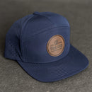 Your Logo on a Leather Patch Flat Bill 7 Panel Perforated Performance Hat - Circle Patch