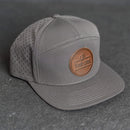 Your Logo on a Leather Patch Flat Bill 7 Panel Perforated Performance Hat - Circle Patch