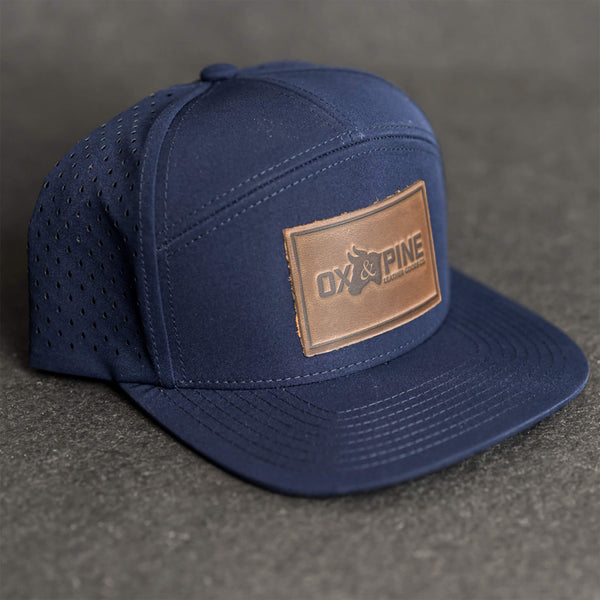 Leather Patch Flat Bill 7 Panel Perforated Performance Hat - Ox & Pine Logo Stamp