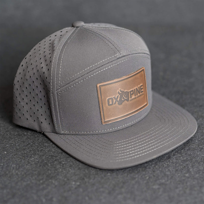 Leather Patch Flat Bill 7 Panel Perforated Performance Hat - Ox & Pine Logo Stamp