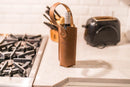 Brown leather wine bottle carrier