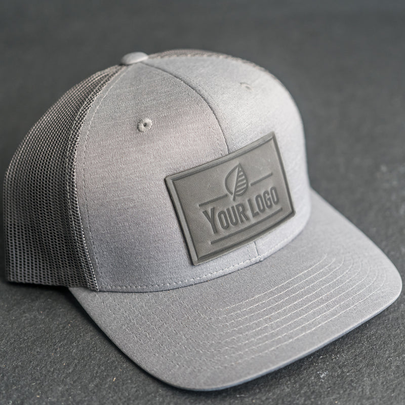 Your Logo on a Leather Patch Performance Style Trucker Hat