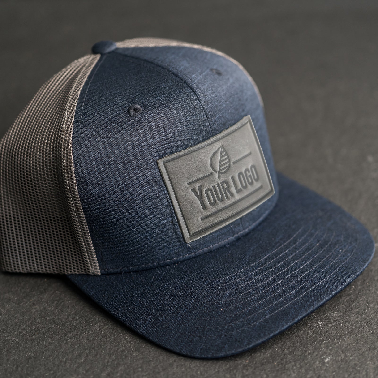 Your Logo on a Leather Patch Performance Style Trucker Hat