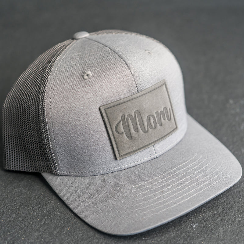 Leather Patch Performance Style Trucker Hat - Mom Cursive Stamp