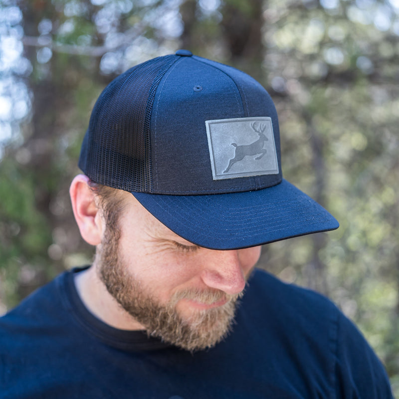 Leather Patch Performance Style Trucker Hat - Deer Stamp