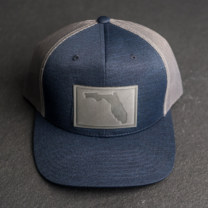Leather Patch Performance Style Trucker Hat - Florida Stamp