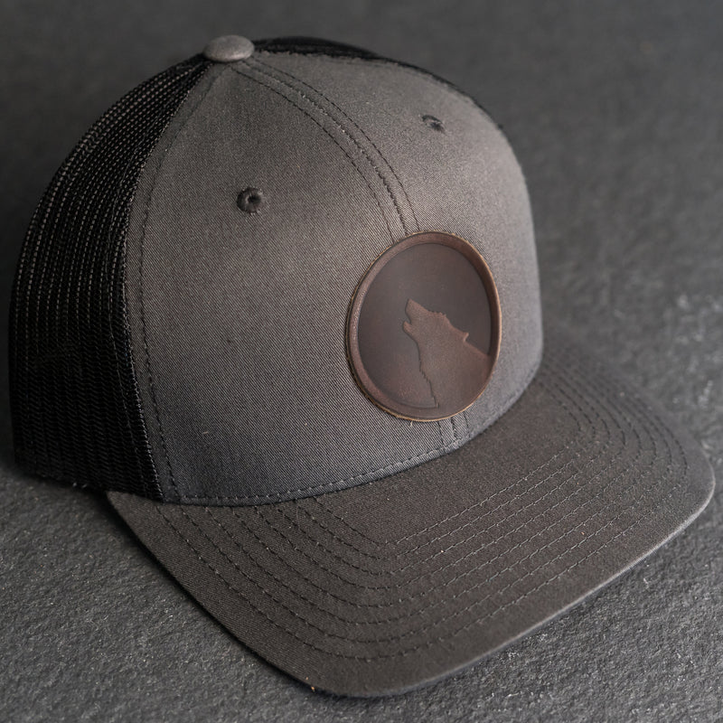 Leather Patch Trucker Style Hat - Wolf Stamp